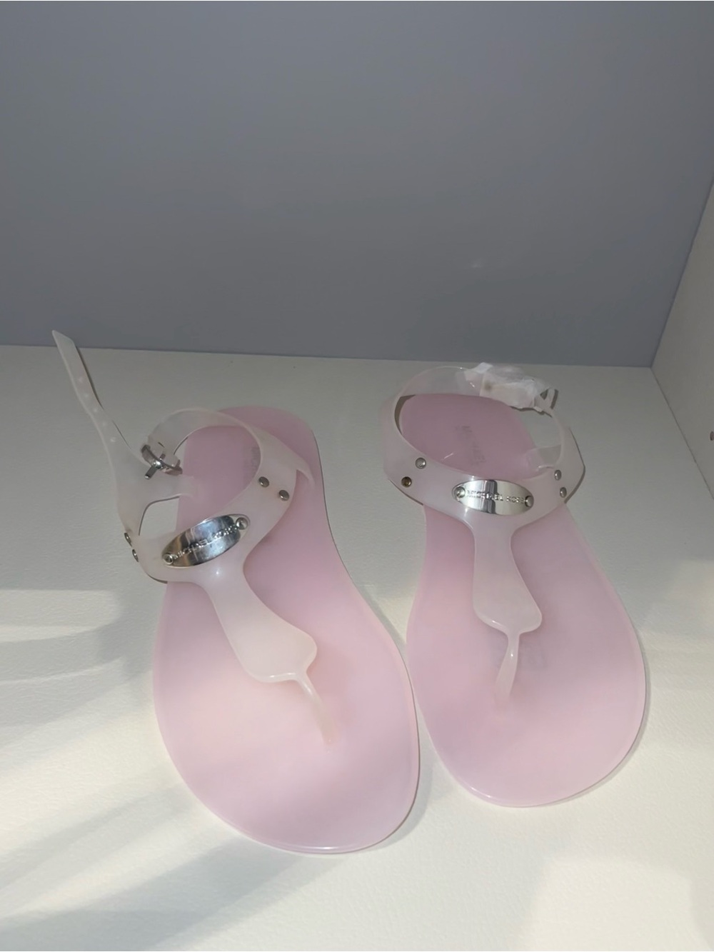 Michael Kors Pink Jelly T-Strap Sandals with Silver Logo Plate